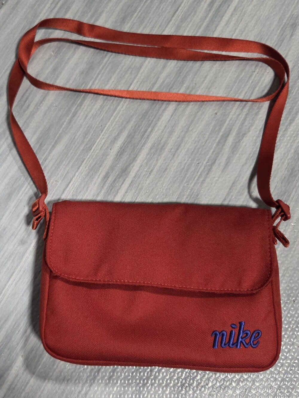 Red Nike Sportswear Futura 365 crossbody bag w/ blue embroidered logo